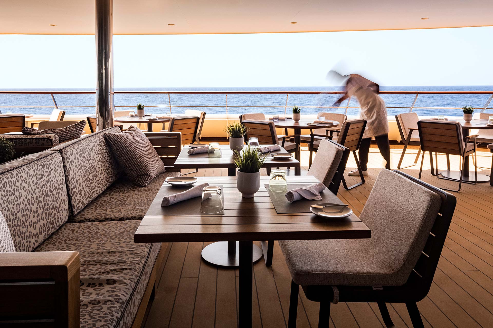 Al fresco Porto dining aboard an Atlas Ocean Voyages yacht