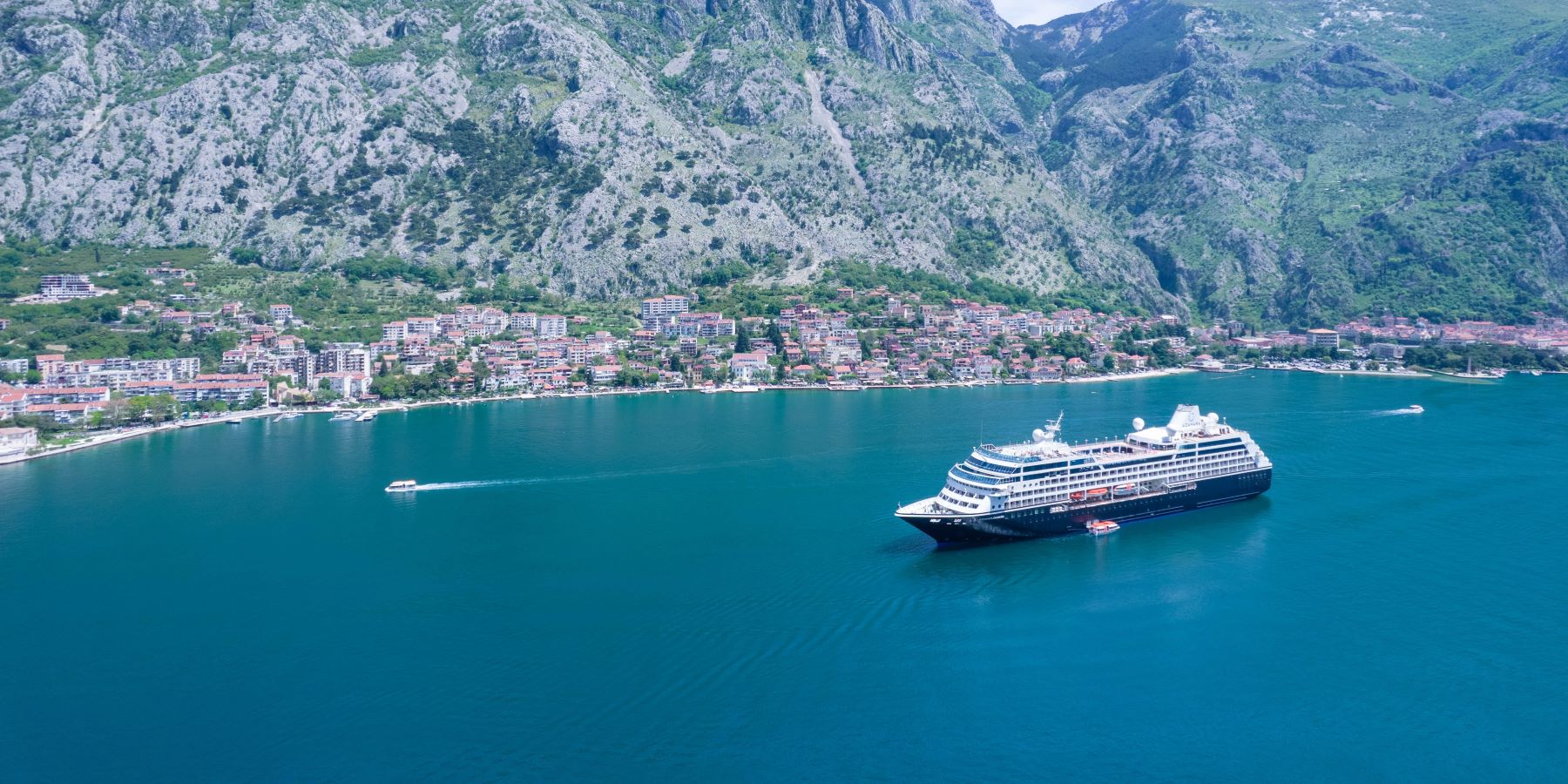 Azamara Onward cruise ship in a coastal harbour