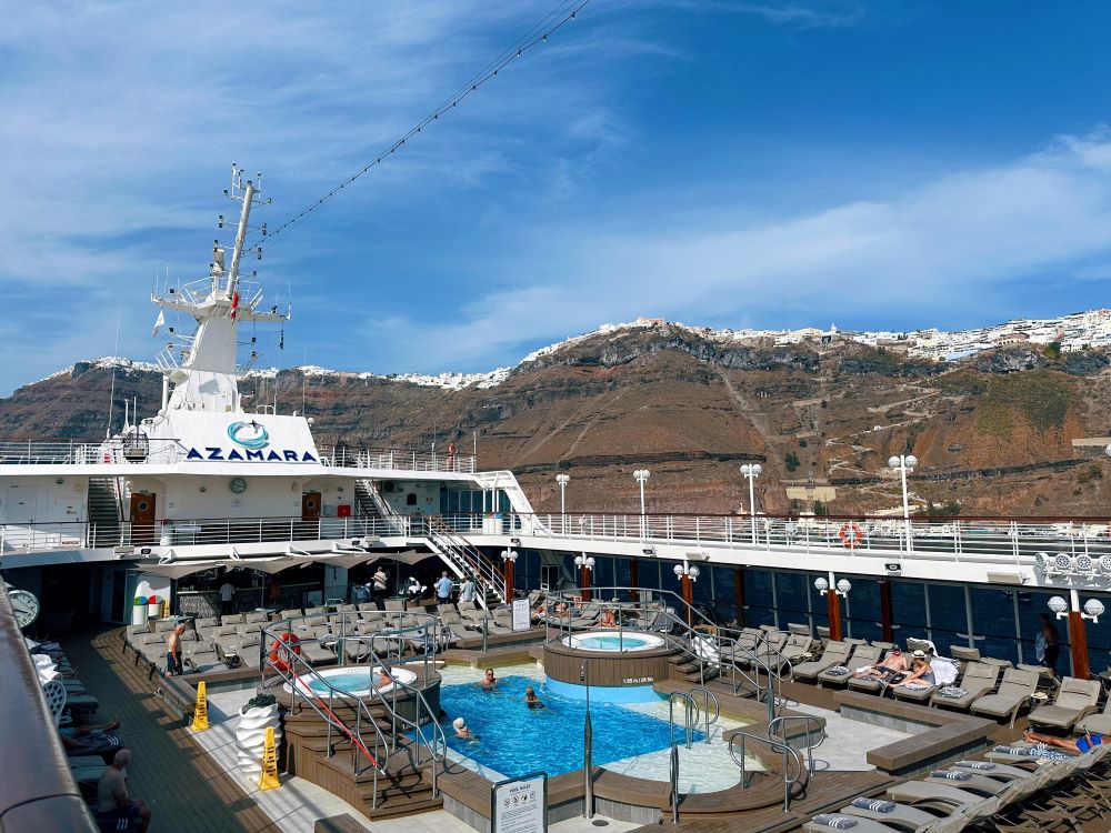 Azamara outdoor swimming pool and surrounding lounge chairs