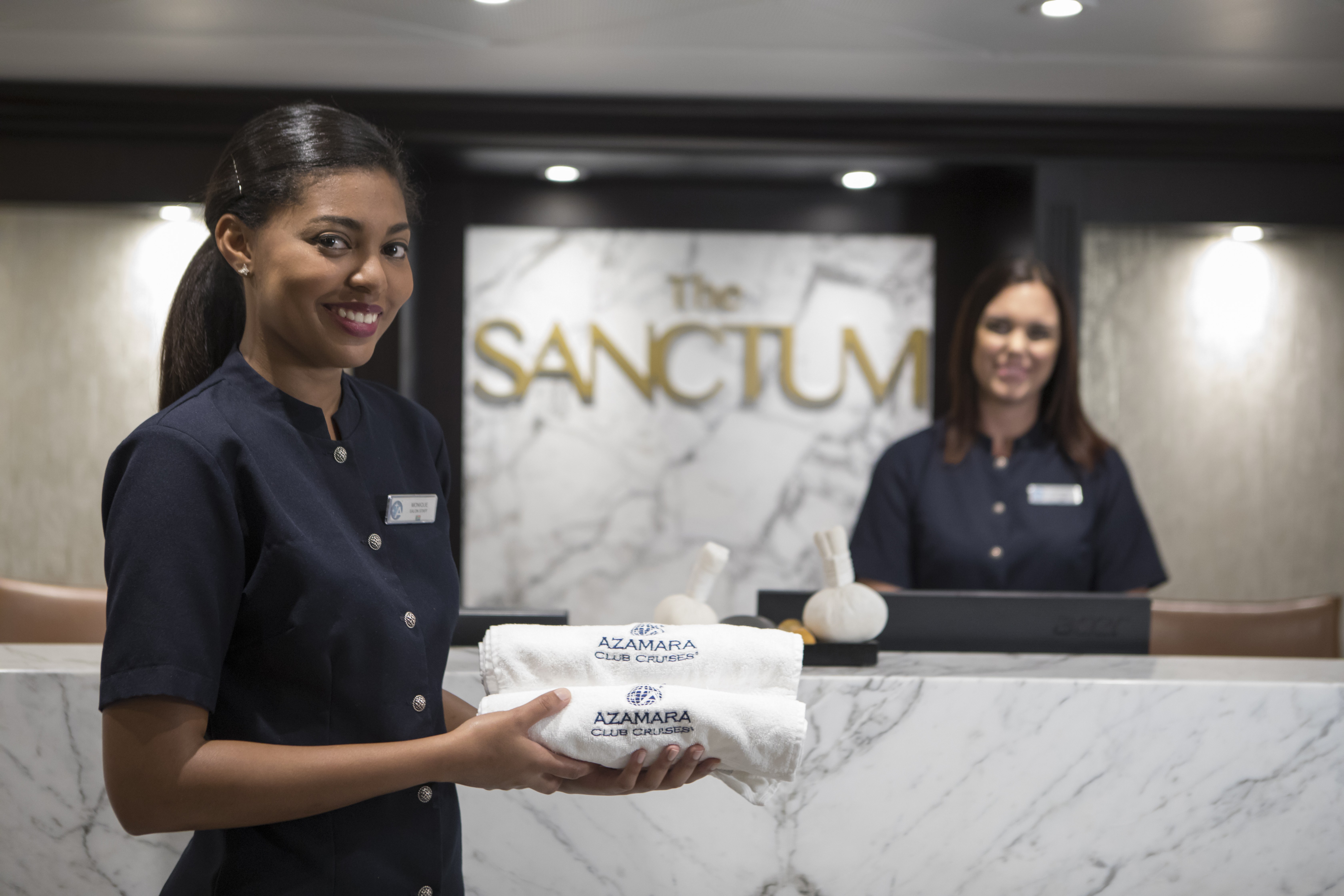Azamara spa staff welcoming guests at the Sanctum Spa reception