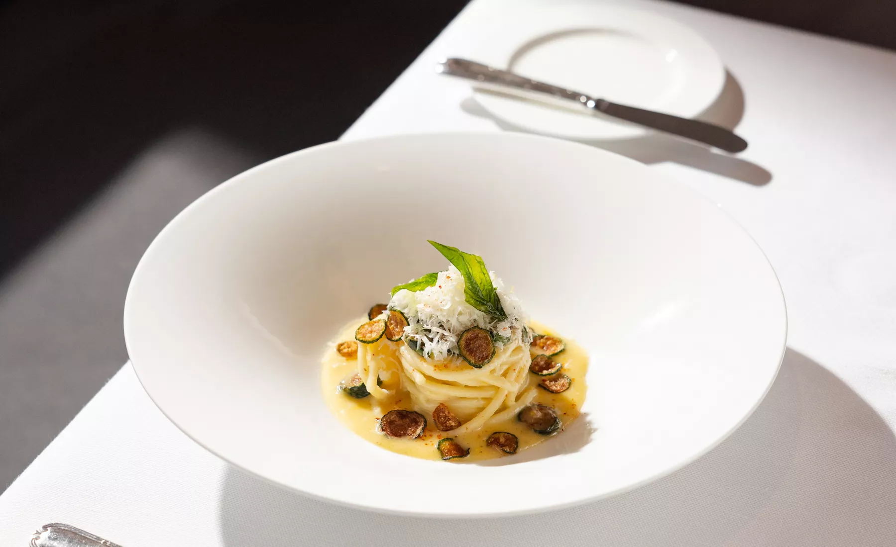 Fine dining presentation in Anthology aboard an Explora ship