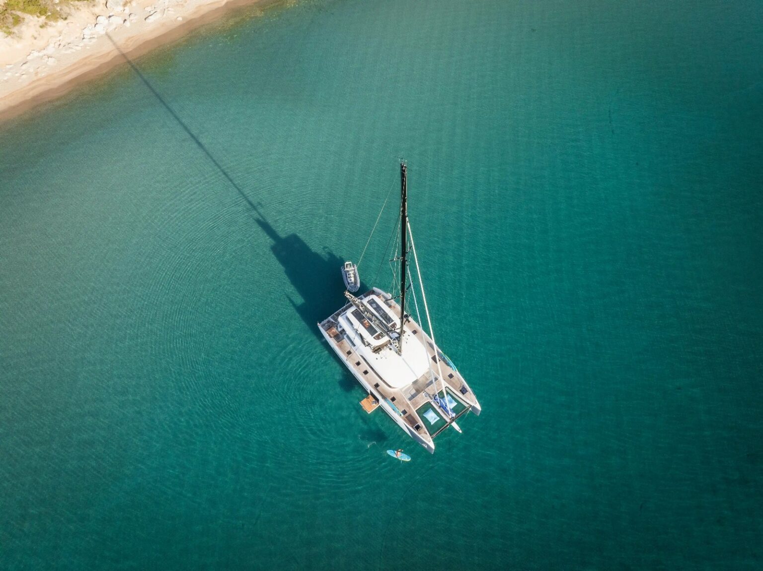 La Désirade sailing catamaran anchored in clear coastal water
