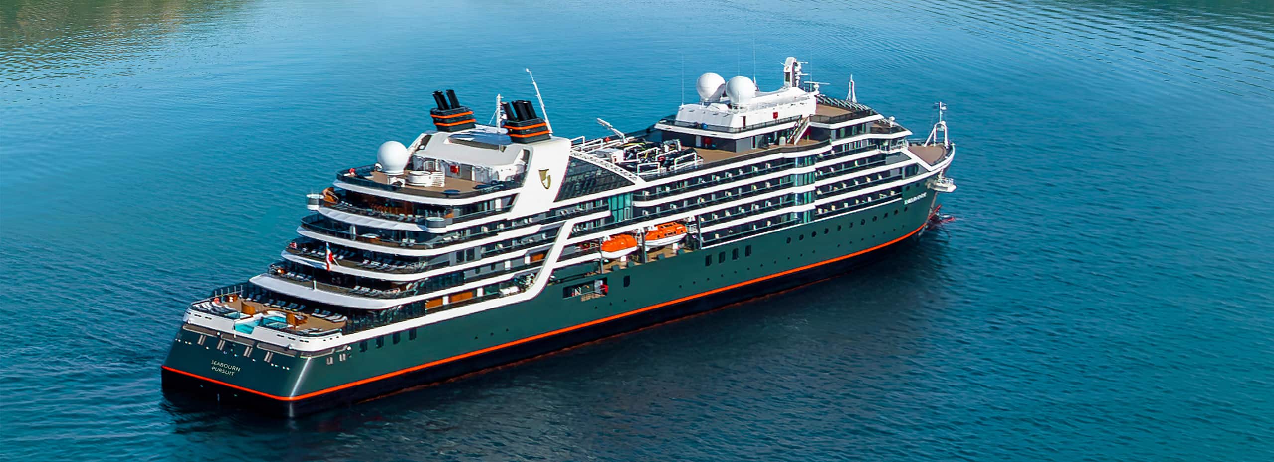 Seabourn Pursuit expedition ship sailing in clear blue water