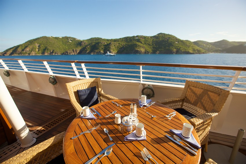 Open-air breakfast setting aboard a SeaDream yacht