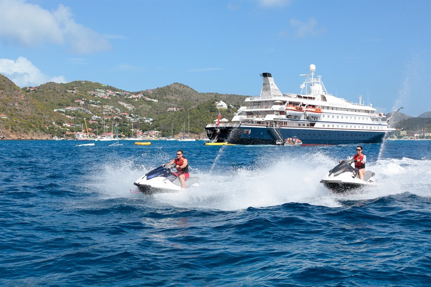 SeaDream marina day with personal watercraft beside the yacht